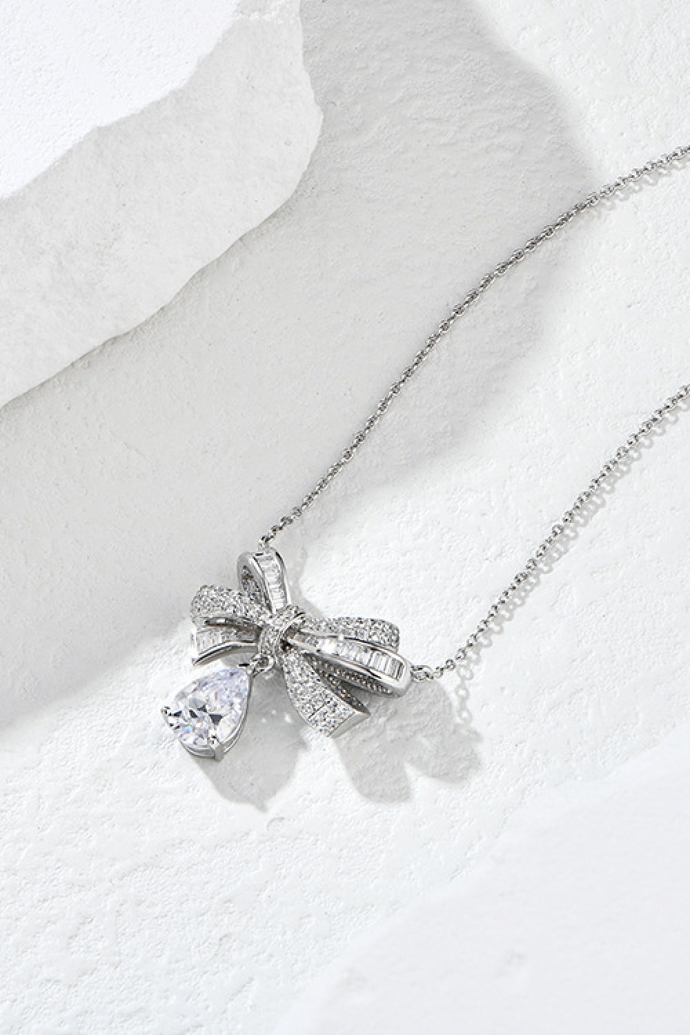 Gorgeous and elegant, this bow teardrop Teardrop Shape 925 Sterling Silver Zircon Pendant Necklace